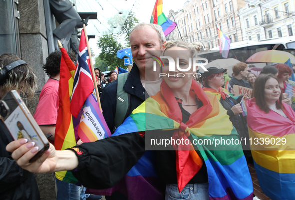 Demonstrators are taking a selfie during the Equality March organized by KyivPride NGO for the first time since the 2022 Russian invasion of...