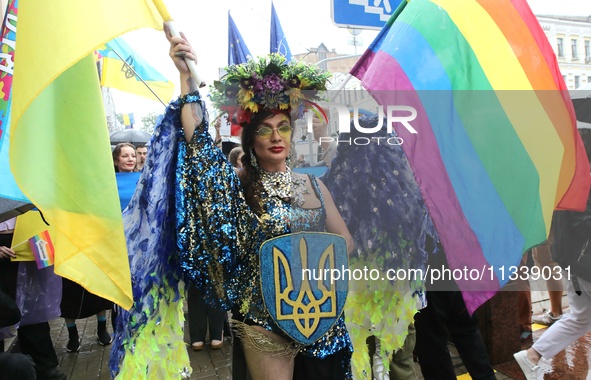 An activist is partaking in the Equality March organized by KyivPride NGO for the first time since the 2022 Russian invasion of Ukraine, in...