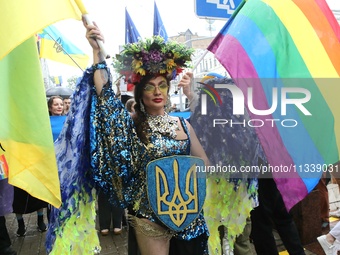 An activist is partaking in the Equality March organized by KyivPride NGO for the first time since the 2022 Russian invasion of Ukraine, in...