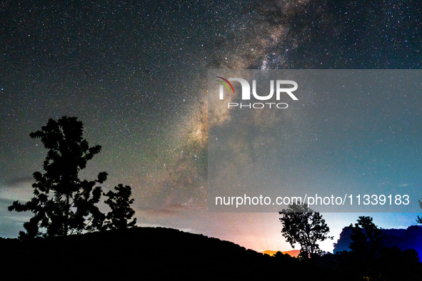 The Milky Way is being seen over the Tea Estate in Ratnapura, Sri Lanka, on June 17, 2024. The Milky Way is a huge collection of stars, dust...