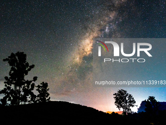 The Milky Way is being seen over the Tea Estate in Ratnapura, Sri Lanka, on June 17, 2024. The Milky Way is a huge collection of stars, dust...