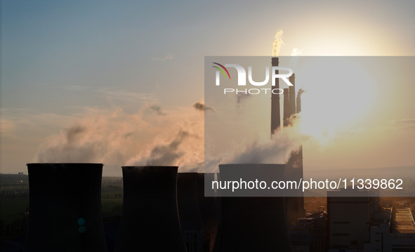 The Datang Electric Power Zhangjiakou Power Plant is being seen at sunset in Zhangjiakou, China, on June 17, 2024. 