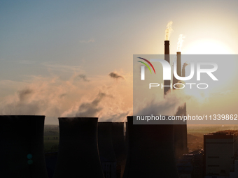 The Datang Electric Power Zhangjiakou Power Plant is being seen at sunset in Zhangjiakou, China, on June 17, 2024. (