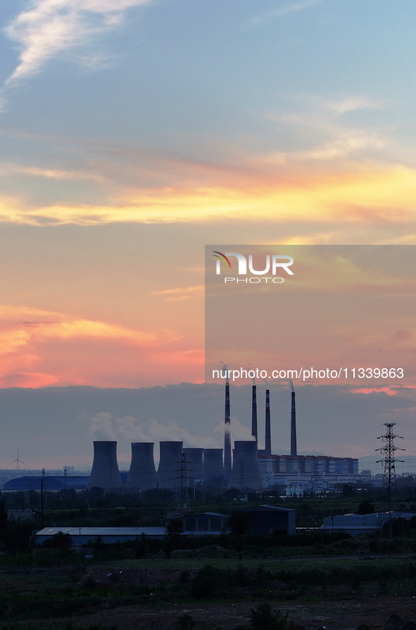 The Datang Electric Power Zhangjiakou Power Plant is being seen at sunset in Zhangjiakou, China, on June 17, 2024. 