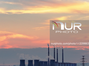 The Datang Electric Power Zhangjiakou Power Plant is being seen at sunset in Zhangjiakou, China, on June 17, 2024. (