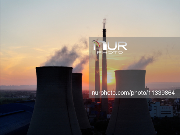 The Datang Electric Power Zhangjiakou Power Plant is being seen at sunset in Zhangjiakou, China, on June 17, 2024. 