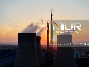 The Datang Electric Power Zhangjiakou Power Plant is being seen at sunset in Zhangjiakou, China, on June 17, 2024. (