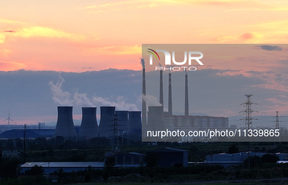 The Datang Electric Power Zhangjiakou Power Plant is being seen at sunset in Zhangjiakou, China, on June 17, 2024. 