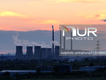 The Datang Electric Power Zhangjiakou Power Plant is being seen at sunset in Zhangjiakou, China, on June 17, 2024. (