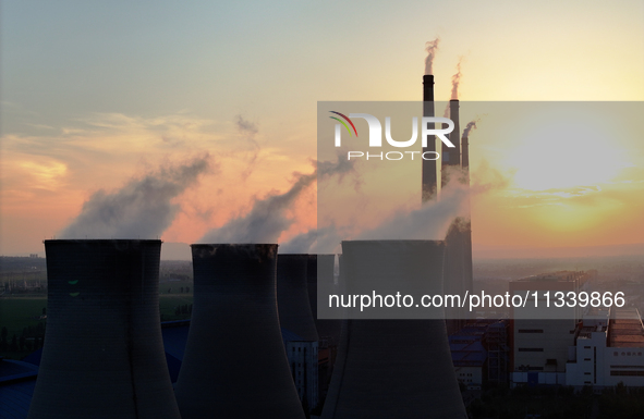 The Datang Electric Power Zhangjiakou Power Plant is being seen at sunset in Zhangjiakou, China, on June 17, 2024. 