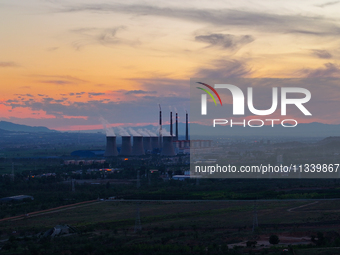 The Datang Electric Power Zhangjiakou Power Plant is being seen at sunset in Zhangjiakou, China, on June 17, 2024. (