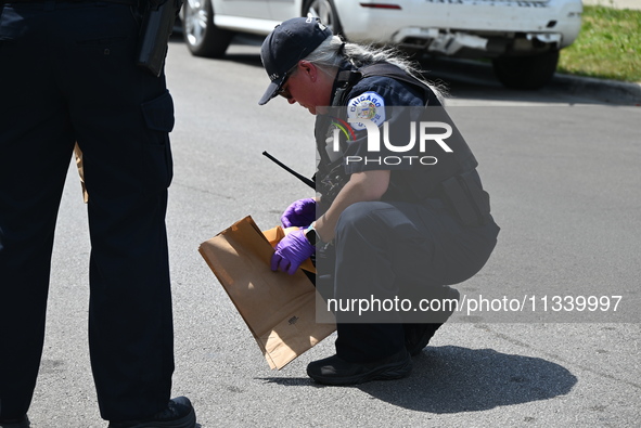 The crime scene unit is collecting evidence at the crime scene. Two people are being shot on W. Maple Street in Chicago, Illinois, United St...