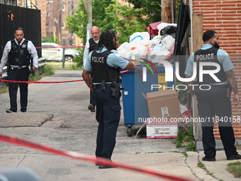 Chicago police officers are investigating in the alley where the shooting is occurring. One person is killed and one person is injured in a...