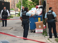 Chicago police officers are investigating in the alley where the shooting is occurring. One person is killed and one person is injured in a...