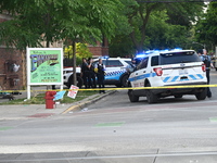 Chicago police are at the crime scene where two people are being shot, with one of the people shot being pronounced dead. One person is bein...