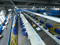 An automated sorting line is delivering express goods at an express logistics company in Taicang, China, on June 18, 2024. (