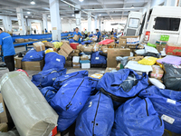 Workers are sorting parcels at an express logistics company in Taicang, China, on June 18, 2024. (