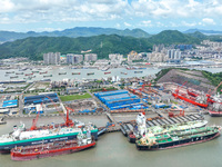 Workers are repairing a ship under the hot sun at the Zhoushan Wanbang Yongyue Ship Repair Co., LTD in Putuo district of Zhoushan City, Zhej...