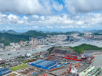 Workers are repairing a ship under the hot sun at the Zhoushan Wanbang Yongyue Ship Repair Co., LTD in Putuo district of Zhoushan City, Zhej...