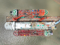 Workers are repairing a ship under the hot sun at the Zhoushan Wanbang Yongyue Ship Repair Co., LTD in Putuo district of Zhoushan City, Zhej...