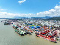 Workers are repairing a ship under the hot sun at the Zhoushan Wanbang Yongyue Ship Repair Co., LTD in Putuo district of Zhoushan City, Zhej...