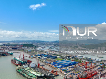 Workers are repairing a ship under the hot sun at the Zhoushan Wanbang Yongyue Ship Repair Co., LTD in Putuo district of Zhoushan City, Zhej...