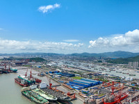 Workers are repairing a ship under the hot sun at the Zhoushan Wanbang Yongyue Ship Repair Co., LTD in Putuo district of Zhoushan City, Zhej...