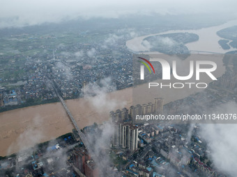 Floodwaters are passing through the Rongan county section of the Rongjiang River in the upper reaches of the Pearl River in Liuzhou, Guangxi...