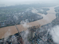 Floodwaters are passing through the Rongan county section of the Rongjiang River in the upper reaches of the Pearl River in Liuzhou, Guangxi...