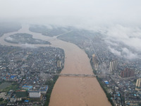 Floodwaters are passing through the Rongan county section of the Rongjiang River in the upper reaches of the Pearl River in Liuzhou, Guangxi...