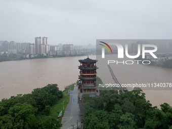 Floodwaters are passing through the Rongan county section of the Rongjiang River in the upper reaches of the Pearl River in Liuzhou, Guangxi...