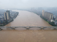 Floodwaters are passing through the Rongan county section of the Rongjiang River in the upper reaches of the Pearl River in Liuzhou, Guangxi...