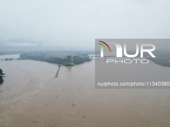 Floodwaters are passing through the Rongan county section of the Rongjiang River in the upper reaches of the Pearl River in Liuzhou, Guangxi...