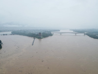 Floodwaters are passing through the Rongan county section of the Rongjiang River in the upper reaches of the Pearl River in Liuzhou, Guangxi...