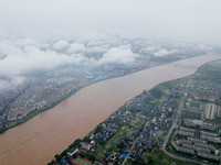 Floodwaters are passing through the Rongan county section of the Rongjiang River in the upper reaches of the Pearl River in Liuzhou, Guangxi...