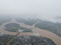 Floodwaters are passing through the Rongan county section of the Rongjiang River in the upper reaches of the Pearl River in Liuzhou, Guangxi...