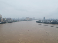 Floodwaters are passing through the Rongan county section of the Rongjiang River in the upper reaches of the Pearl River in Liuzhou, Guangxi...