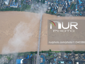 Floodwaters are passing through the Rongan county section of the Rongjiang River in the upper reaches of the Pearl River in Liuzhou, Guangxi...