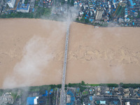 Floodwaters are passing through the Rongan county section of the Rongjiang River in the upper reaches of the Pearl River in Liuzhou, Guangxi...