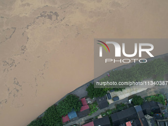 Floodwaters are passing through the Rongan county section of the Rongjiang River in the upper reaches of the Pearl River in Liuzhou, Guangxi...