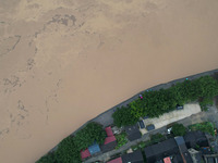 Floodwaters are passing through the Rongan county section of the Rongjiang River in the upper reaches of the Pearl River in Liuzhou, Guangxi...