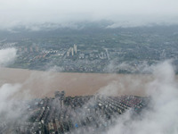 Floodwaters are passing through the Rongan county section of the Rongjiang River in the upper reaches of the Pearl River in Liuzhou, Guangxi...