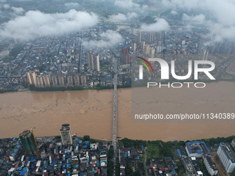 Floodwaters are passing through the Rongan county section of the Rongjiang River in the upper reaches of the Pearl River in Liuzhou, Guangxi...