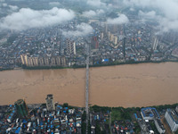 Floodwaters are passing through the Rongan county section of the Rongjiang River in the upper reaches of the Pearl River in Liuzhou, Guangxi...