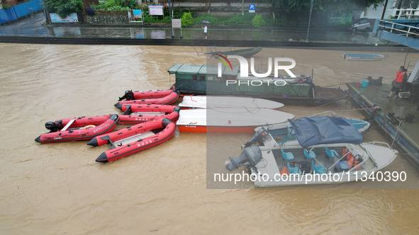 Floodwaters are passing through the Rongan county section of the Rongjiang River in the upper reaches of the Pearl River in Liuzhou, Guangxi...