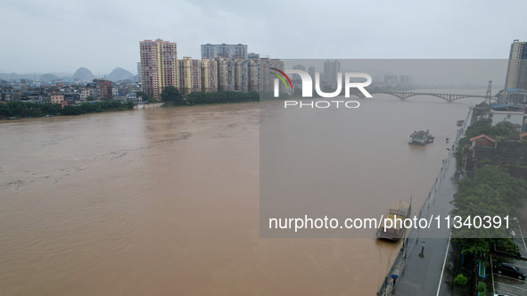 Floodwaters are passing through the Rongan county section of the Rongjiang River in the upper reaches of the Pearl River in Liuzhou, Guangxi...