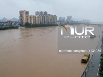 Floodwaters are passing through the Rongan county section of the Rongjiang River in the upper reaches of the Pearl River in Liuzhou, Guangxi...