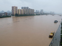 Floodwaters are passing through the Rongan county section of the Rongjiang River in the upper reaches of the Pearl River in Liuzhou, Guangxi...