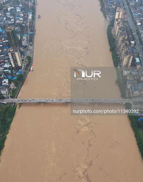 Floodwaters are passing through the Rongan county section of the Rongjiang River in the upper reaches of the Pearl River in Liuzhou, Guangxi...