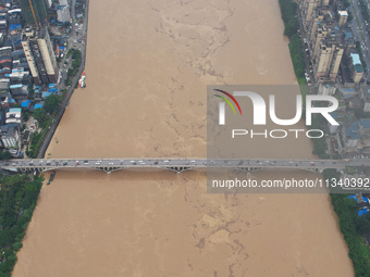 Floodwaters are passing through the Rongan county section of the Rongjiang River in the upper reaches of the Pearl River in Liuzhou, Guangxi...